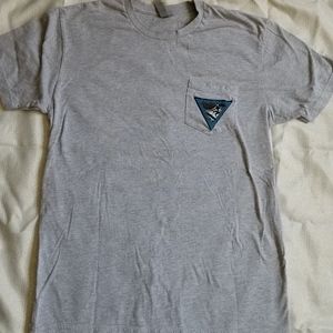 Grey pocket tee with VINTAGE patch/tag on pocket